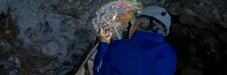 Geophysicist checks the veins of a mineral underground
