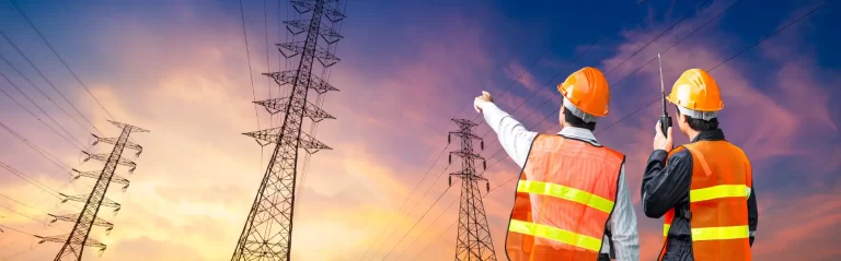 electrical engineers looking at high tension cables