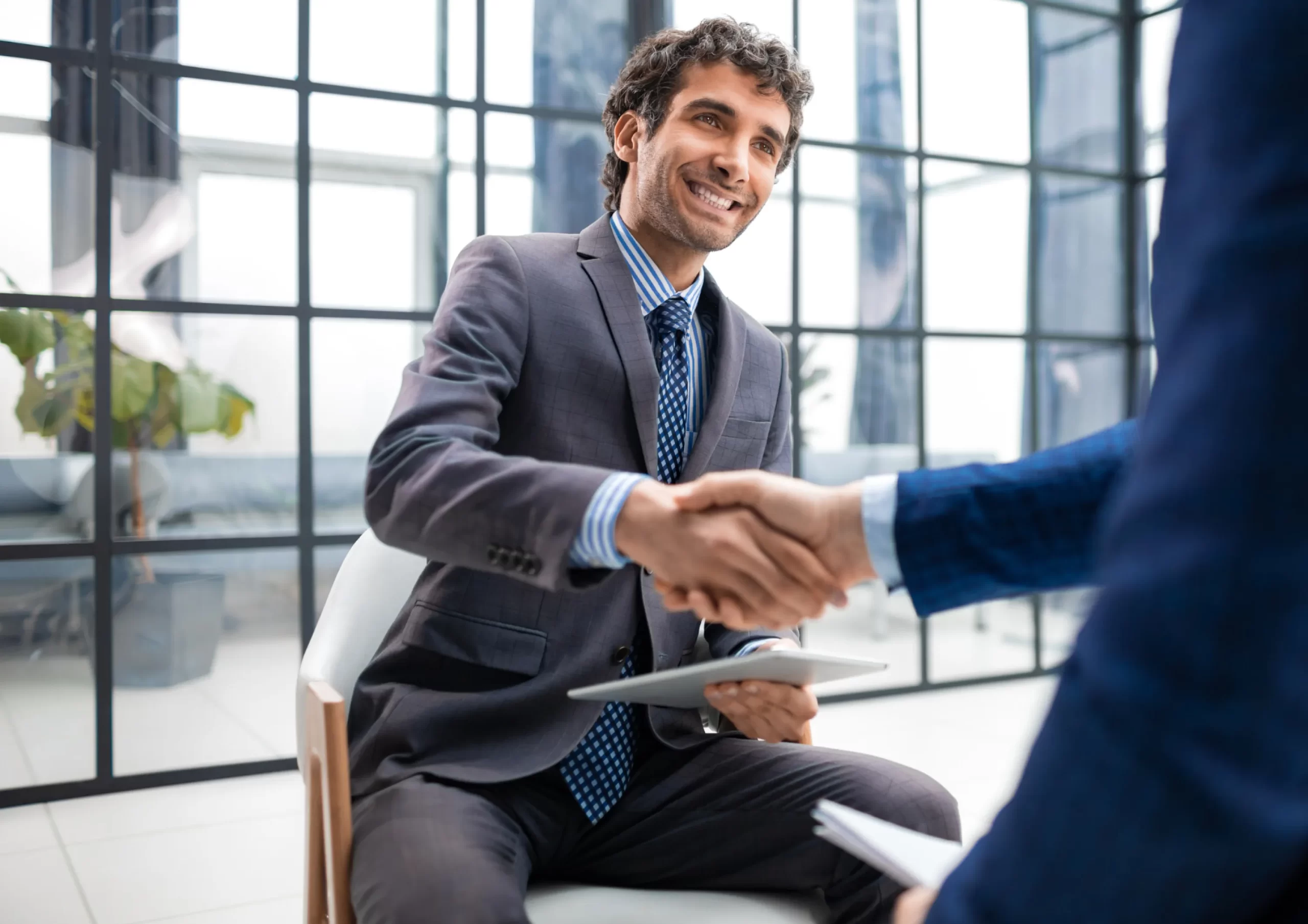 Applicants shake hands with recruiter after going through recruitment services in the Mexico